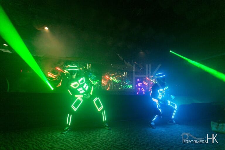 Dancers in multi colored LED costumes