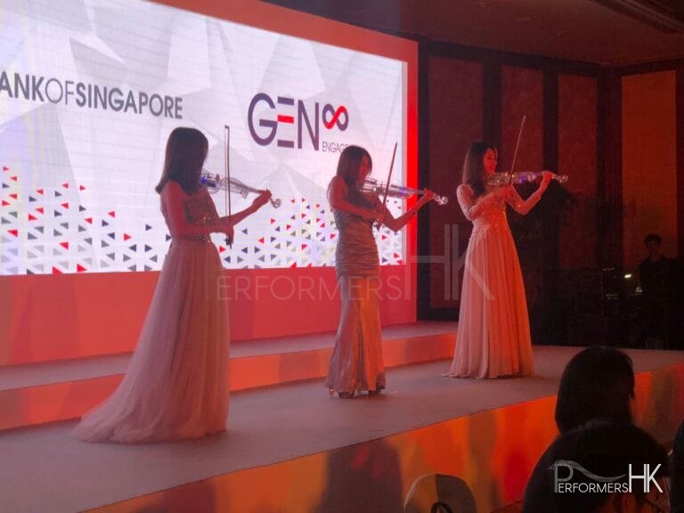 3 violinist using LED violins performance on stage