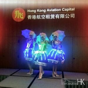 Three Model dancer posing with three little lace umbrella at a Hong Kong corporate event