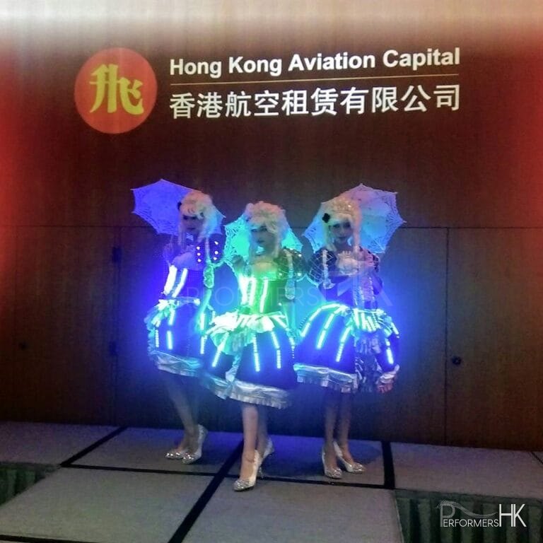 Three Model dancer posing with three little lace umbrella at a Hong Kong corporate event