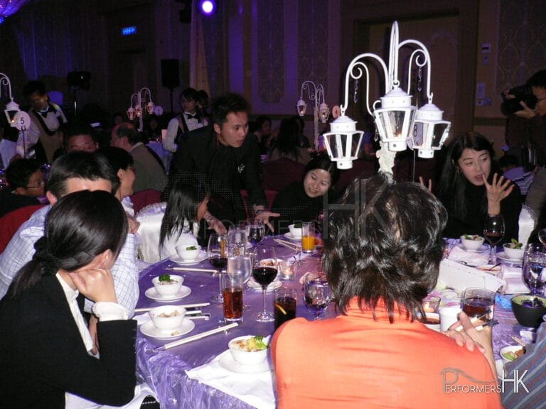 Hong Kong walk around magician performing table magic at corporate annual dinner