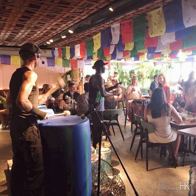 drummers at an event perfroming with eco friendly drums with guests