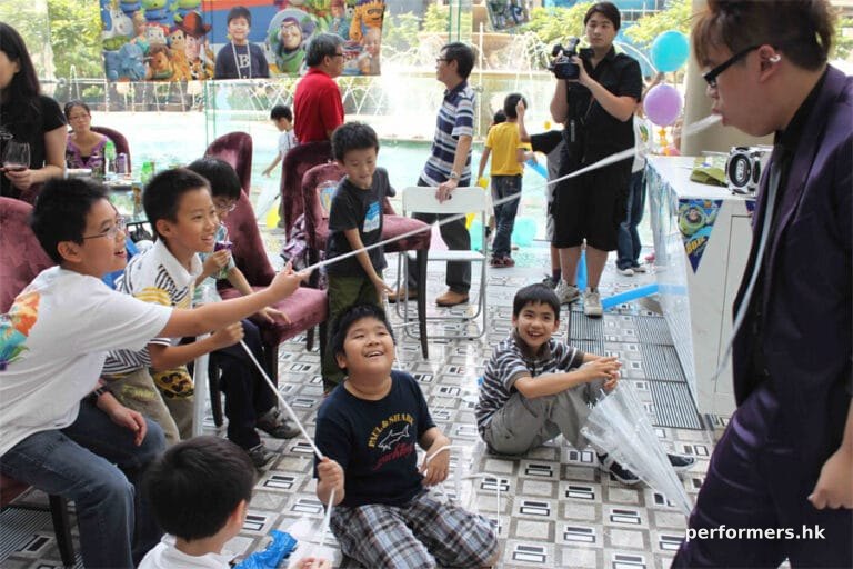 Joker and kids when he does his magic tricks