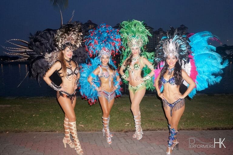 Dancers in multi colored costumes