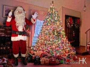 Hong Kong Santa taking in front of a Xmas tree for a corporate Christmas event.