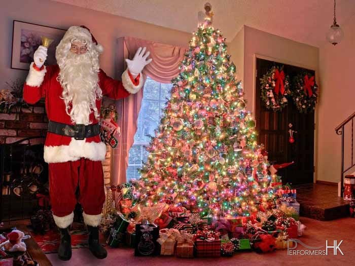 Hong Kong Santa taking in front of a Xmas tree for a corporate Christmas event.