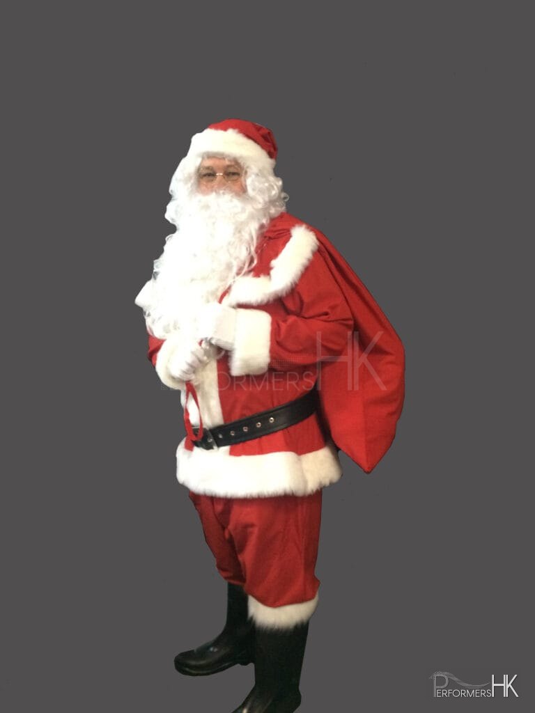 Hong Kong performer dress as Santa , carrying a Santa Bag on his back for a corporate Christmas event.