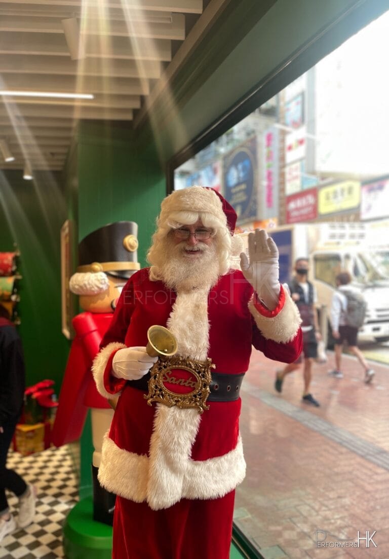 Santa Martin saying hello to guests in front of HK causeway bay sogo store in his red suit and bell