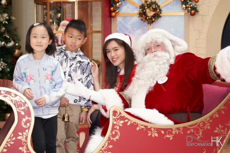 Santa with santa girl and kids