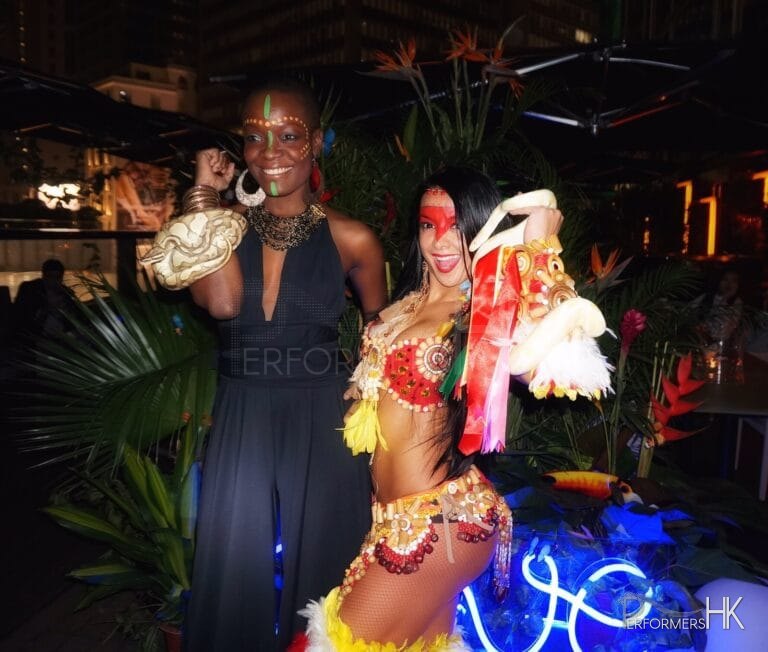 Hong Kong female snake charmer photographs with her snakes