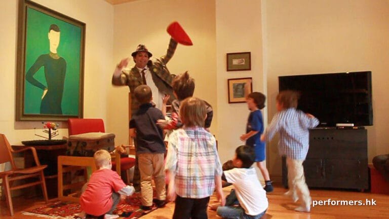Hong Kong juggler holding a red bag going to give out candies to the kids at the birthday party