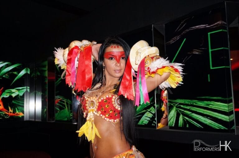 Model with 2 snakes wrapped around her at a corporate function
