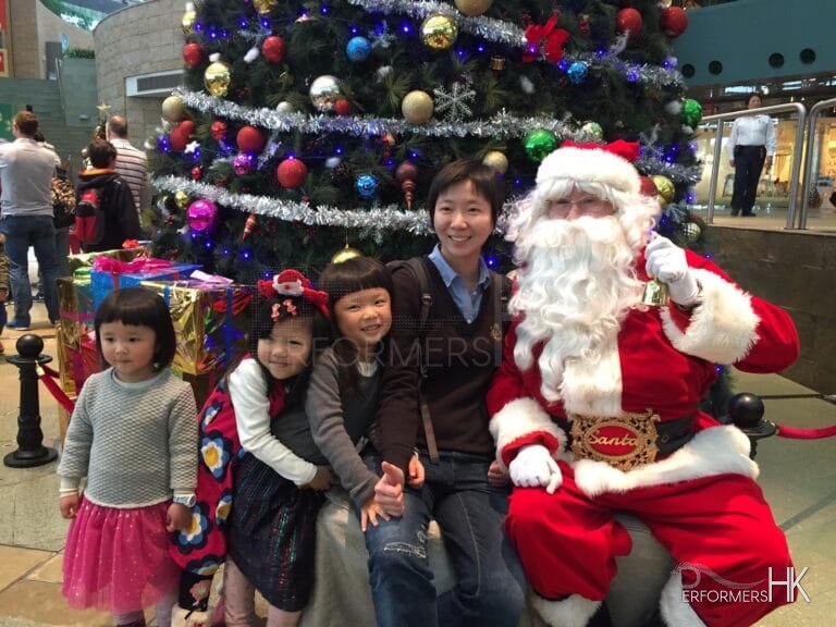 Family taking photos with Santa Steve