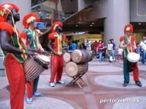 African drummer in colorful costumes in Causeway Bay HK