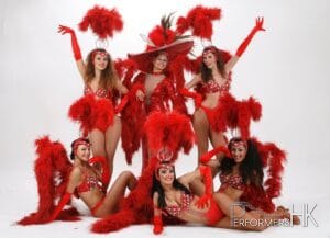 6 vegas dancers pose for camera studio shot