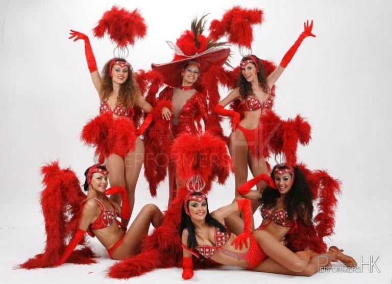 6 vegas dancers pose for camera studio shot
