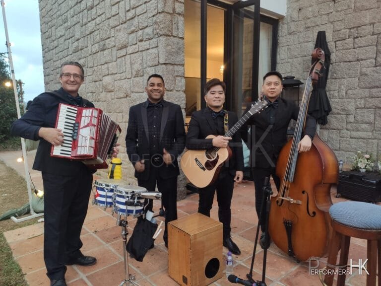 4 musicians carrying their instruments at an event in repulse bay Hong Kong