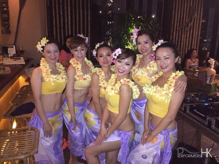 Hong Kong female hula and Tahitian dancers perform in a restaurant