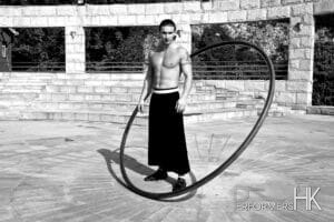 HK acrobatics artist posing with his wheel for a corporate event