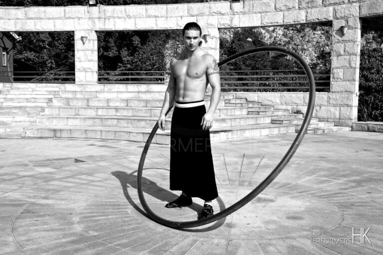 HK acrobatics artist posing with his wheel for a corporate event