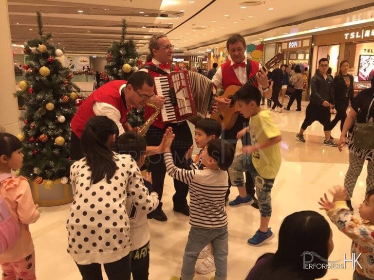 Musicians in red vest playing in mall in Hong Kong 2015