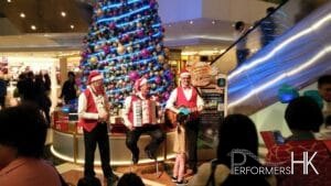 Accordion sax and guitar player during Xmas performing