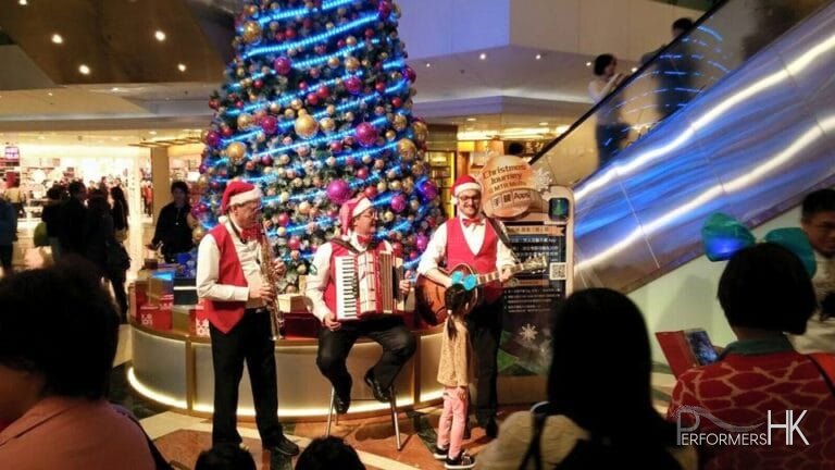 Accordion sax and guitar player during Xmas performing