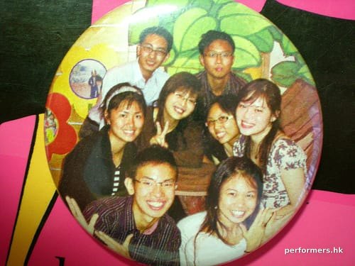 badge with a group photo of guests at an event