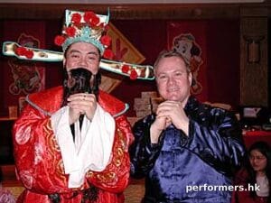 Choi Sun Performer in HK Posing with CEO at a corporate Chinese New Year event