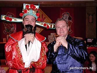 Choi Sun Performer in HK Posing with CEO at a corporate Chinese New Year event