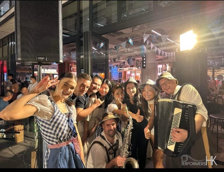 revellers partying with our german band in authentic costume with german beer girls