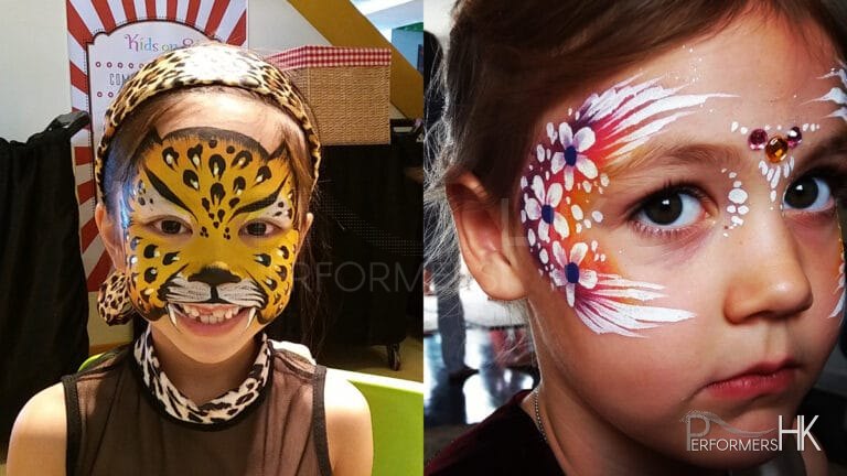 two little girls with flowers and tiger face paint