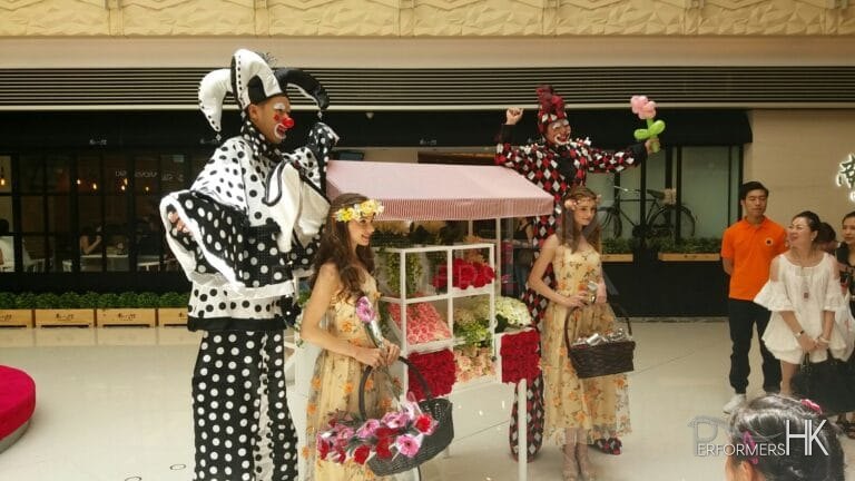 Two stilts walkers at Elements Shopping mall in Kowloon Hong Kong