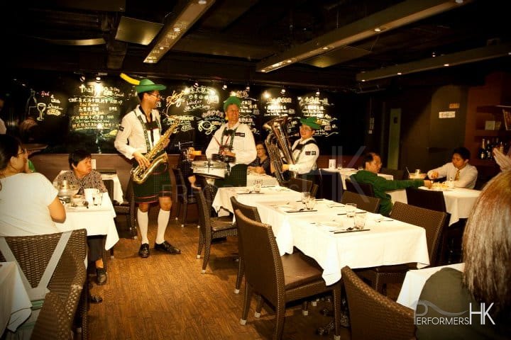 a three piece roving band in a restaurant in Hong Kong
