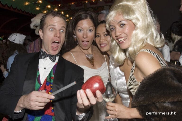 Magician producing an apple