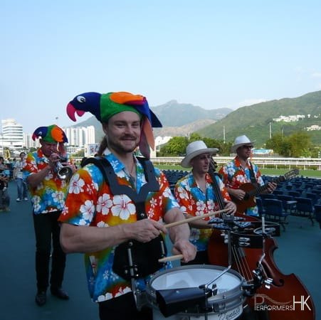 Four HK musician walking around at a corporate function.