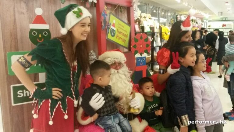 Santa clause and female elf in shopping centre in Hong Kong