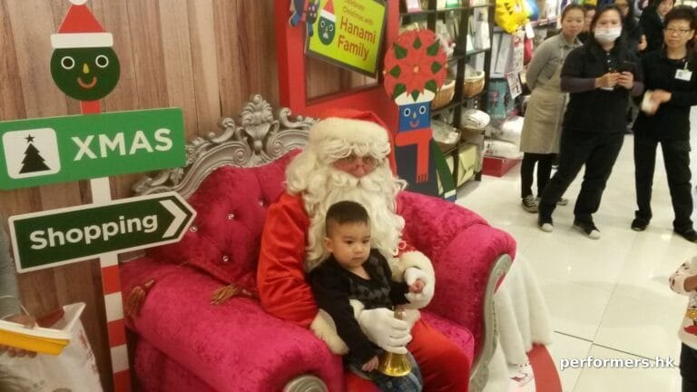 Santa sitting with small child on this throne in SOGO