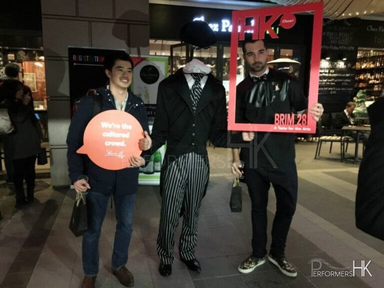 Headless man living state performing next to a cafe in a Hong Kong shopping mall