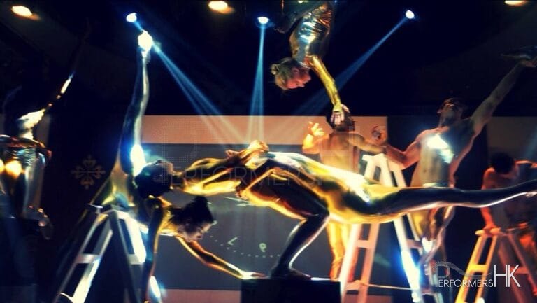 Eight Acrobat performers performing at a corporate event