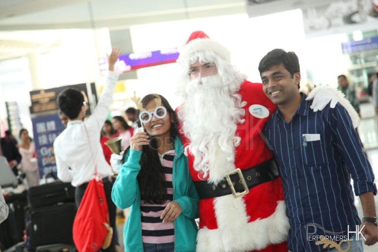 Santa posing with patrons at Hong Kong airport