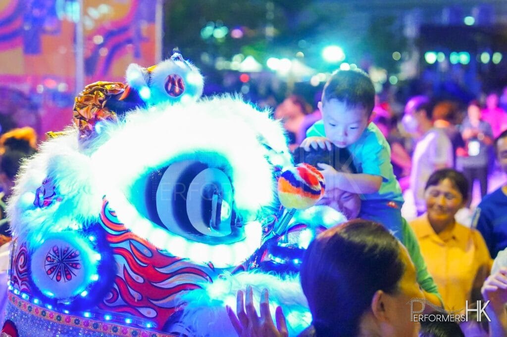 child with LED lion mascot for an event in hong kong 2023 by the hong kong government