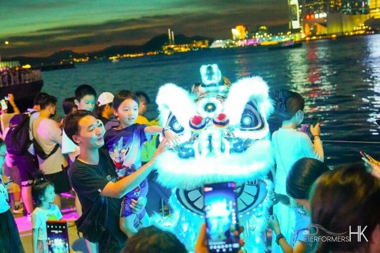led lion lit up in wan chai harbour front next to wan chai ferry pier