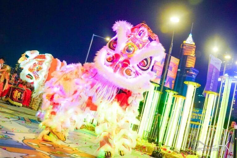 led lion dancers in red led shinning on floor before getting up on to stilts led performance hong kong
