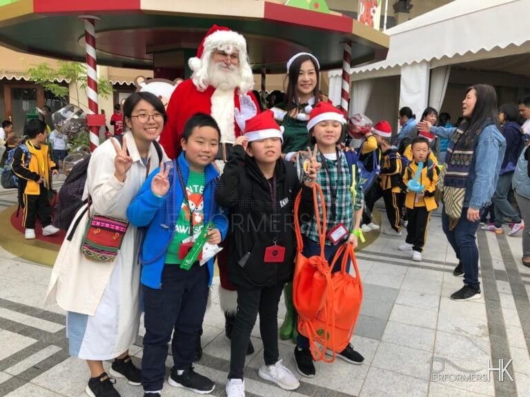 santa in hong kong with kids from an event, kids are in their casual clothing, charity event