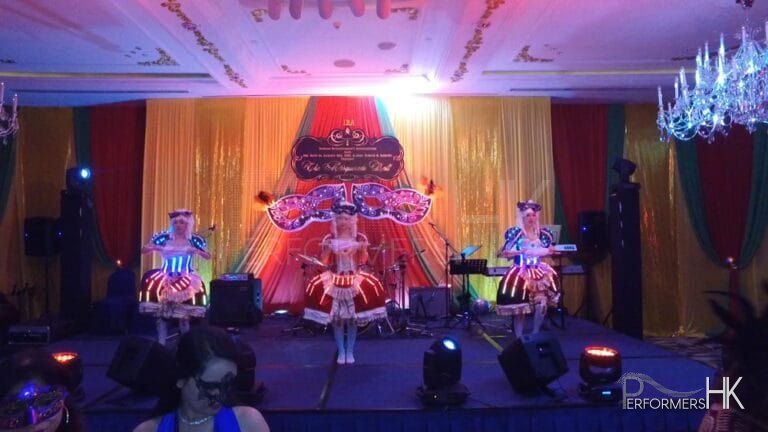 Three Dancers in Maries Marionette LED costume performing stage dance performance at a corporate annual dinner