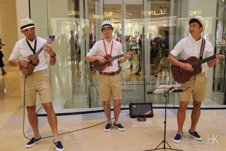 Three Ukulele players performing in Hong Kong shopping mall