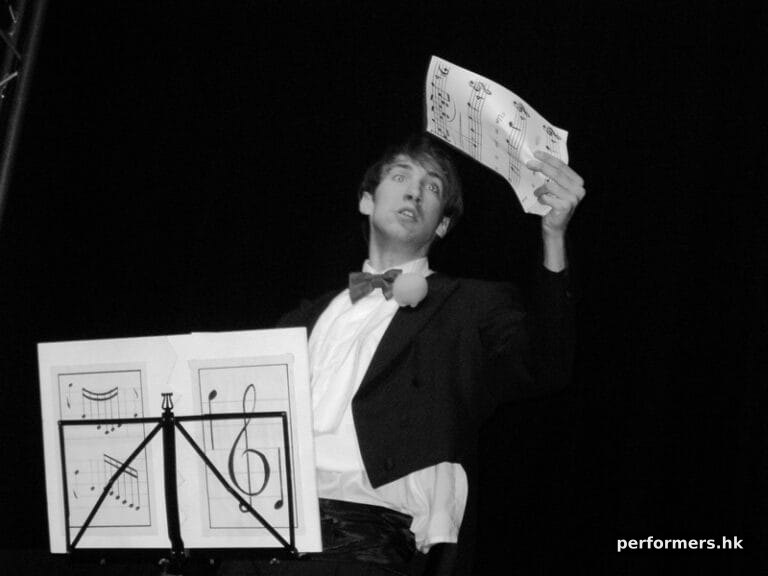 Magician performing a trick with sheet music