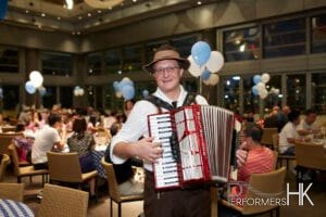 Musician performing Accordion at Hong Kong Happy Valley Jockey Clubhouse