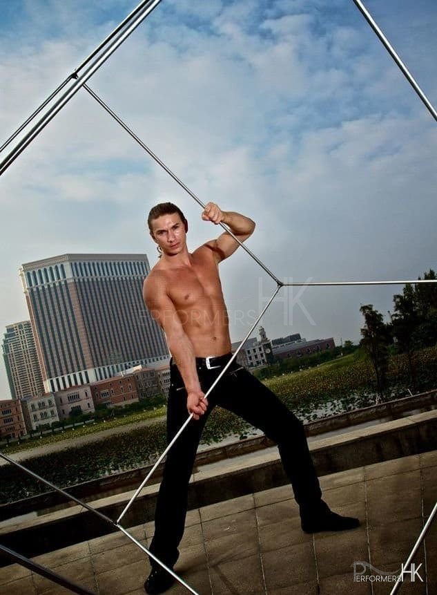 An Acrobat performer posing with his cube before the corporate event start.